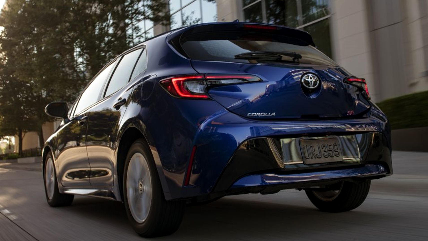 2023 Toyota Corolla Hatchback accelerating rear third quarter view