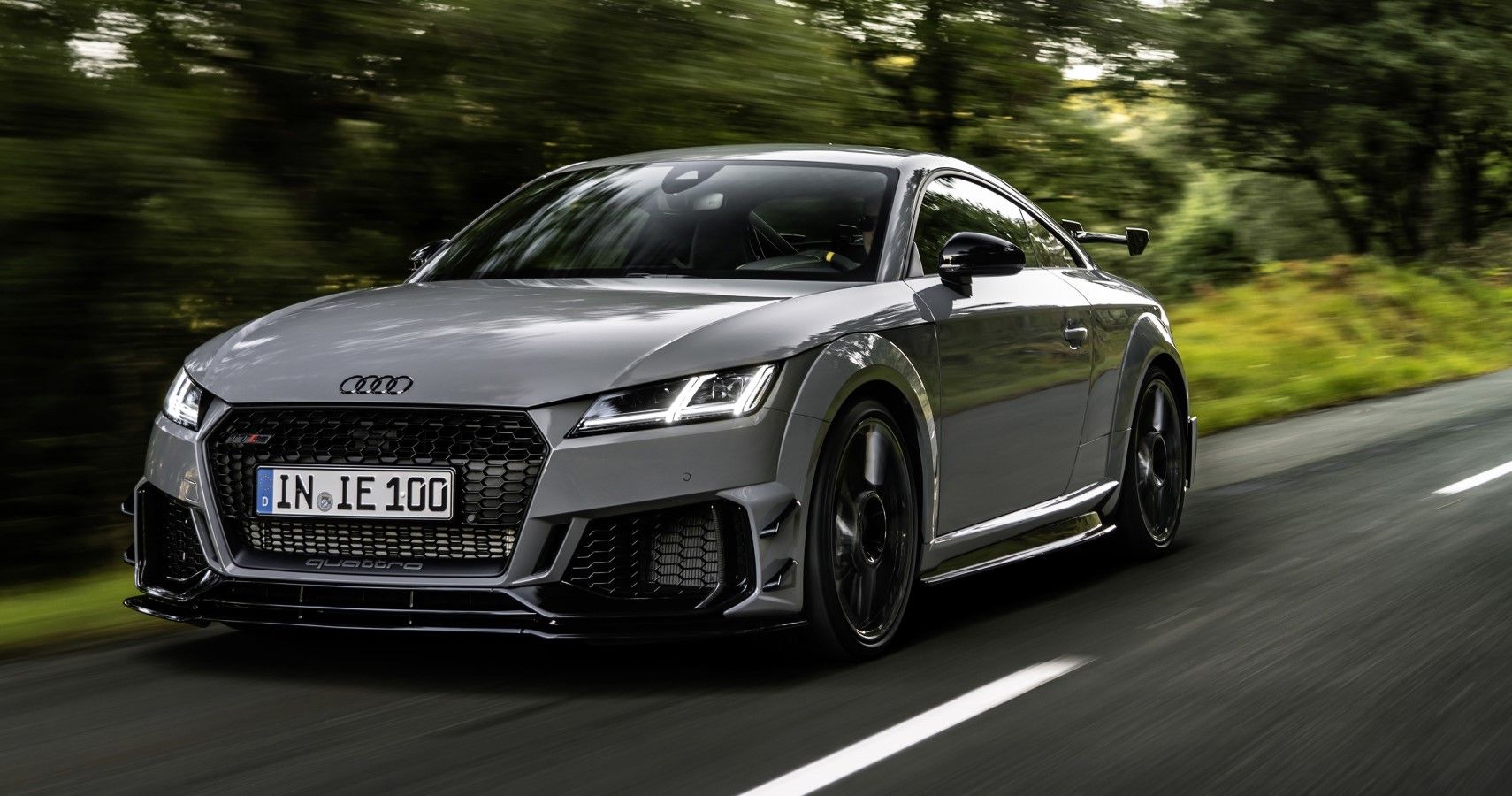 Audi TT RS Coupe Iconic Edition accelerating front third quarter view