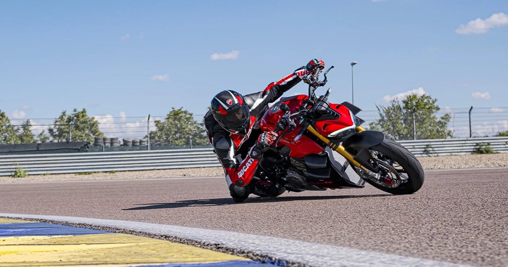 2023 Ducati Streetfighter V4 cornering aggresively on a racetrack