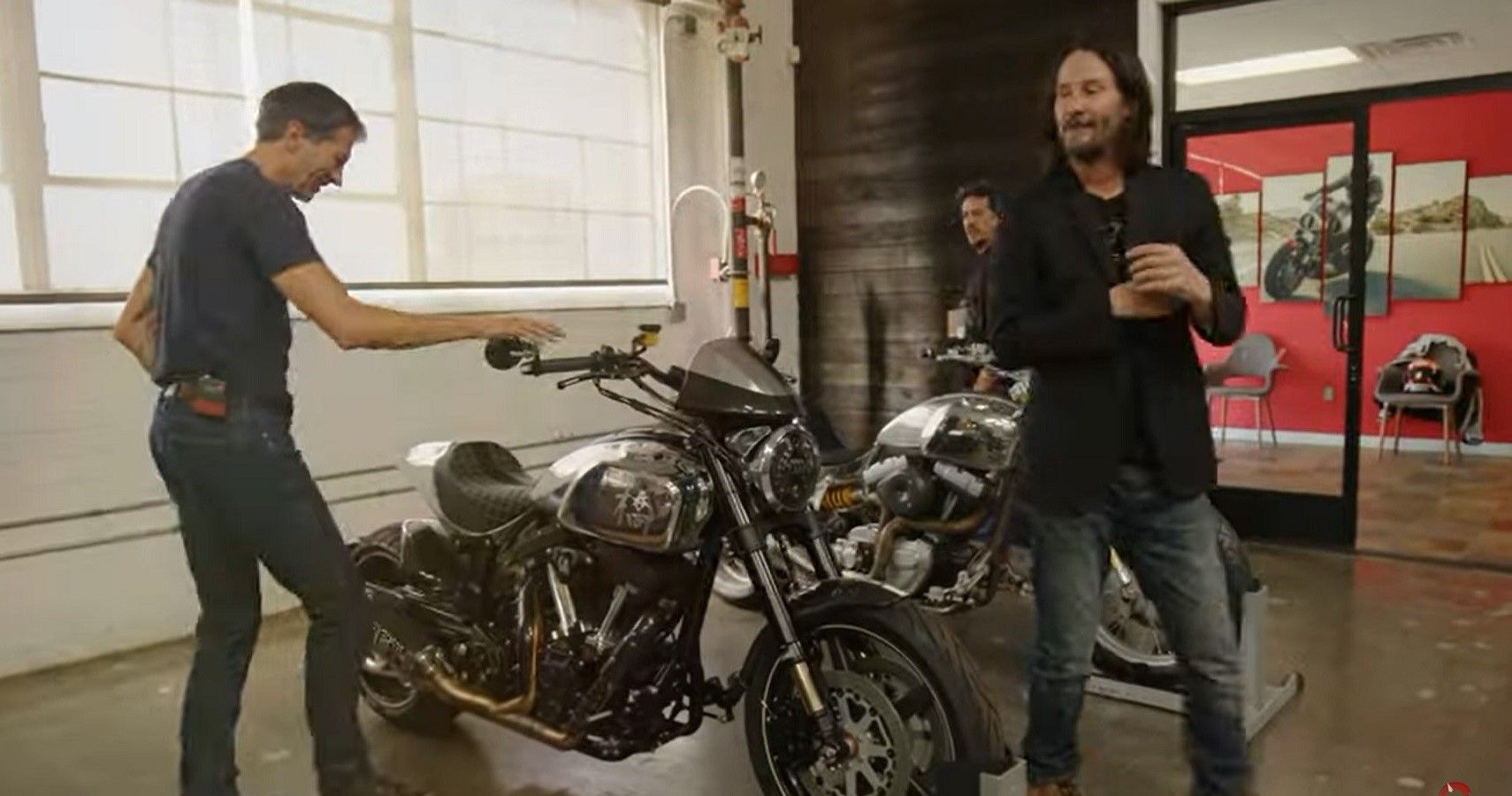Keanu Reeves and Guy Pickrell, motorcycle in center
