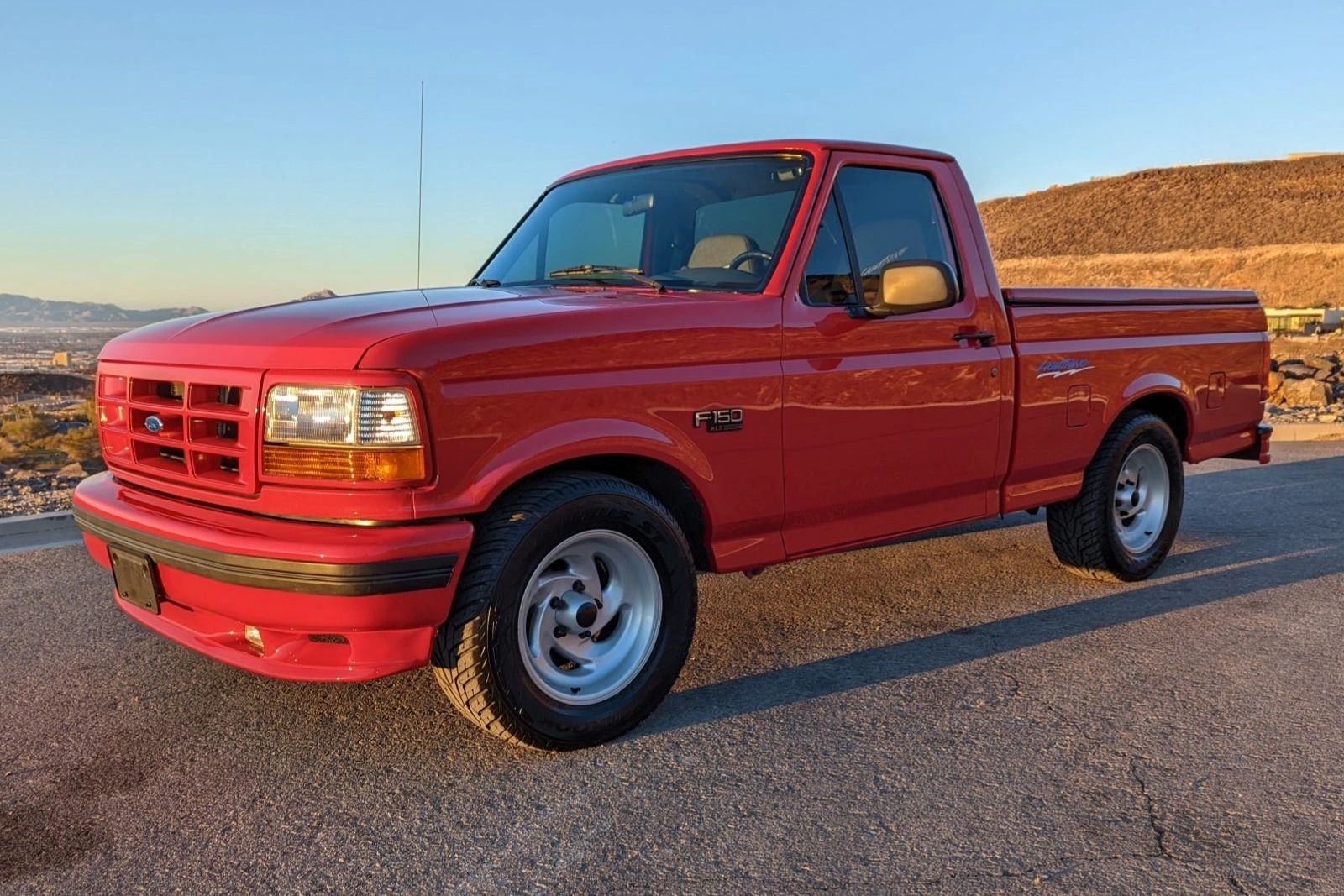 Red 1993 Ford F-150 SVT Lightning Parked Outside