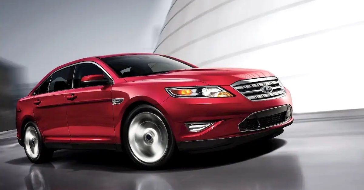 Red 2011 FORD TAURUS SHO on the road