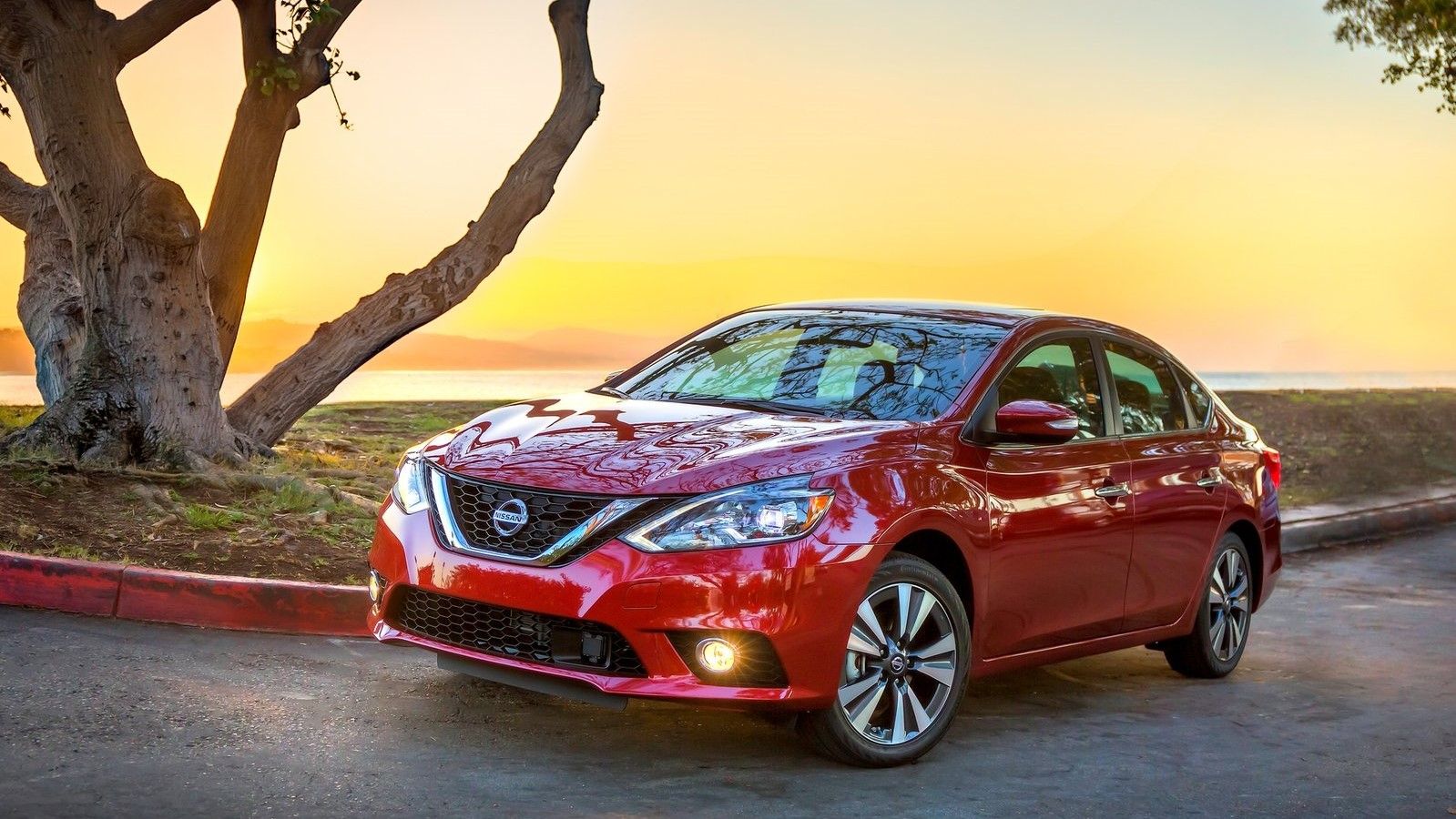 2016 Red Nissan Sentra on the road