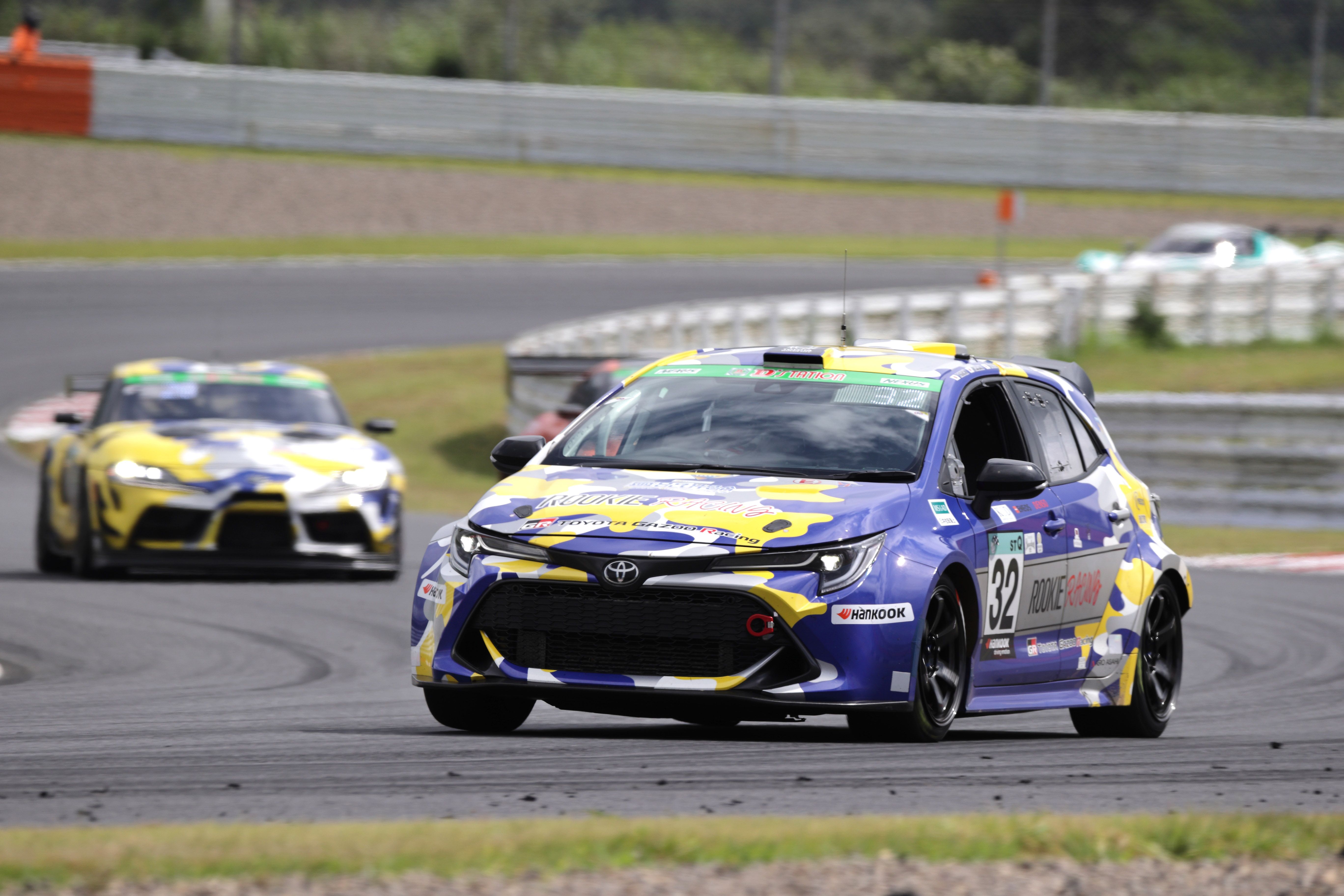 Blue and yellow hydrogen powered Corolla racecar on track