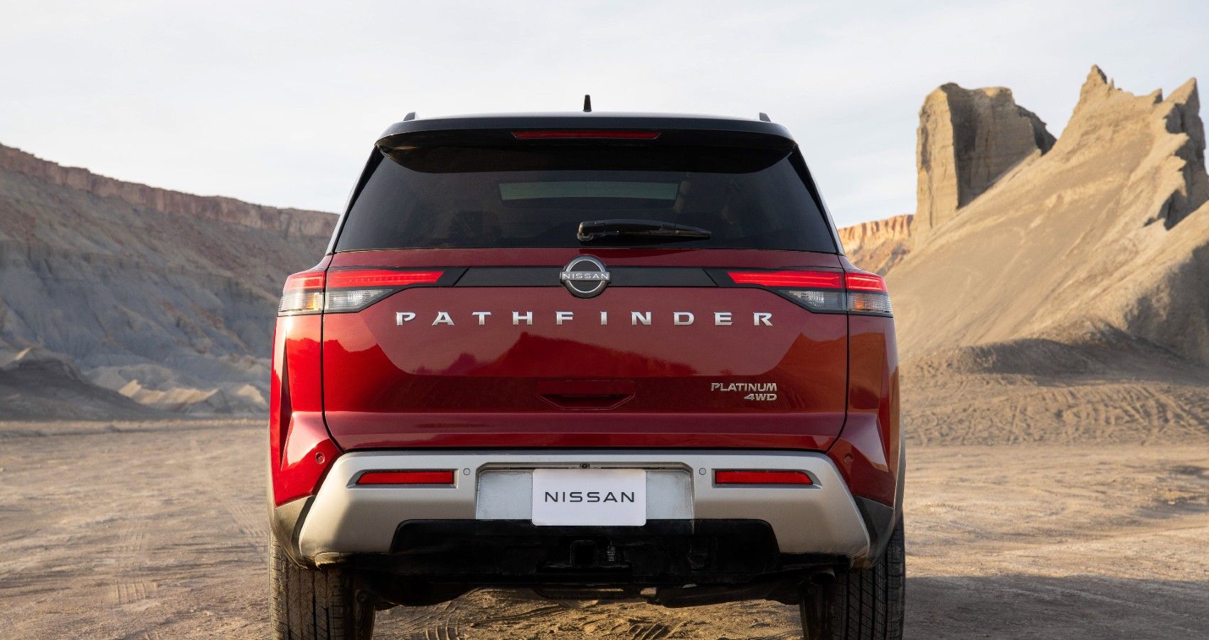 Red 2022 Nissan Pathfinder on the road