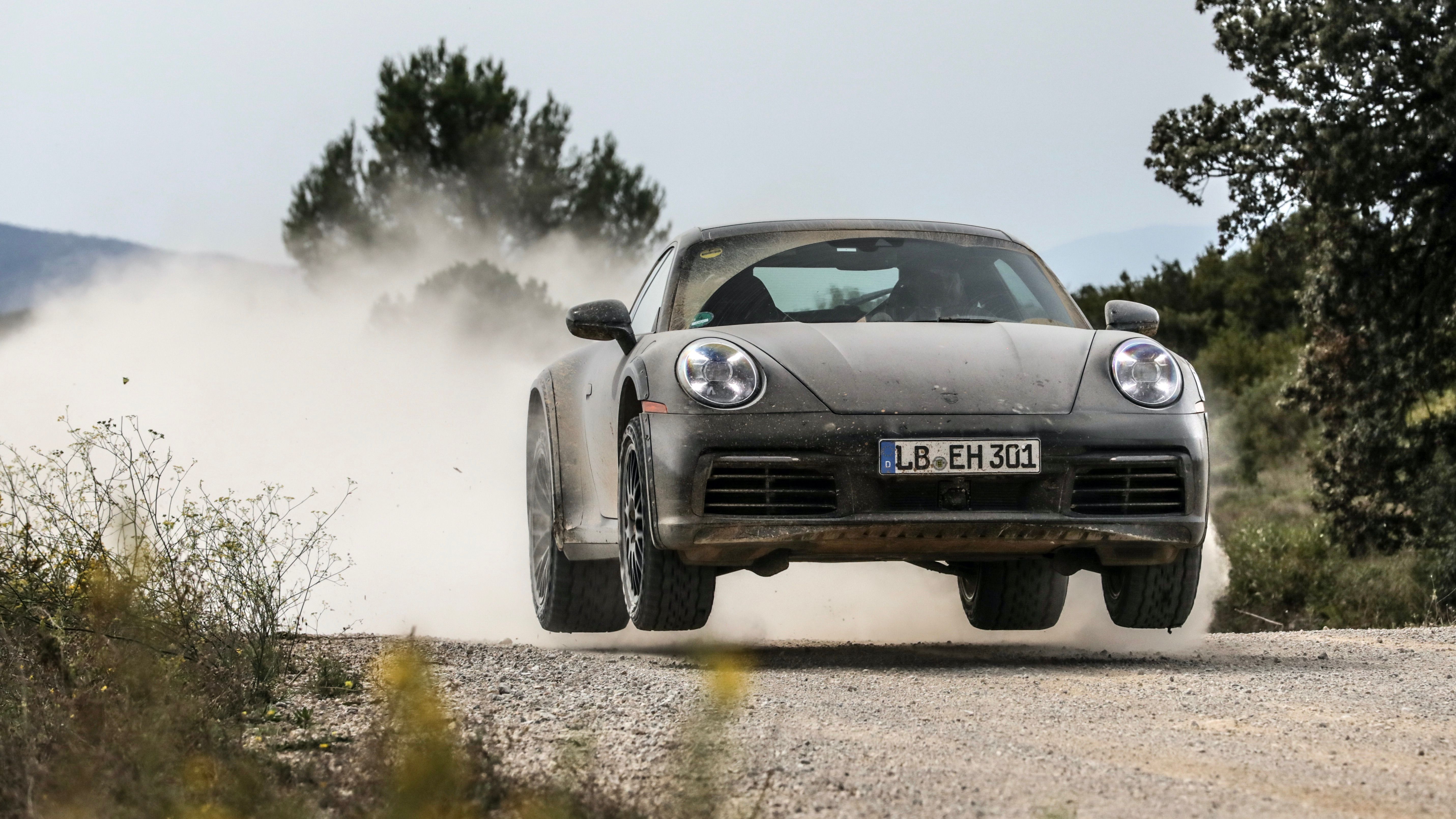 Black 2023 Porsche 911 Dakar Making A Jump
