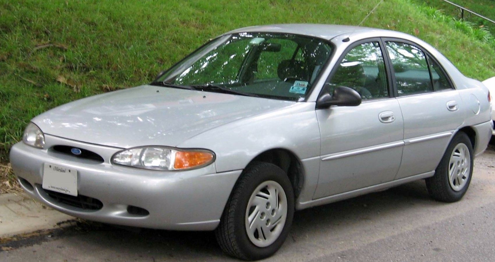 Ford Escort Silver 1997 parked outside