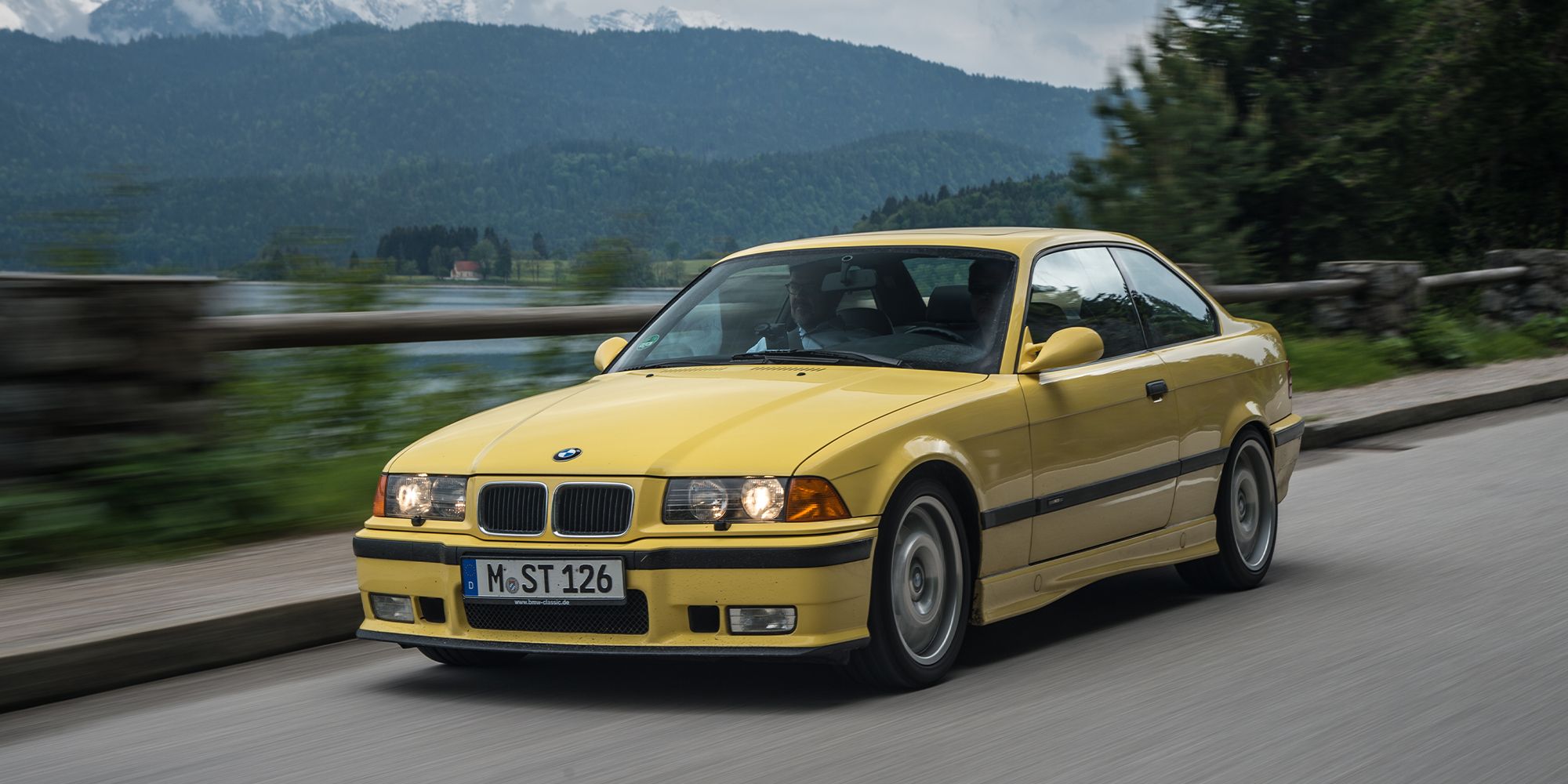BMW M3 E36 front quarter yellow driving