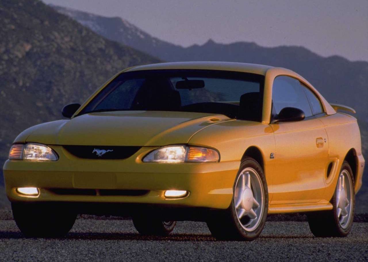 Yellow 1994 Ford Mustang GT Parked