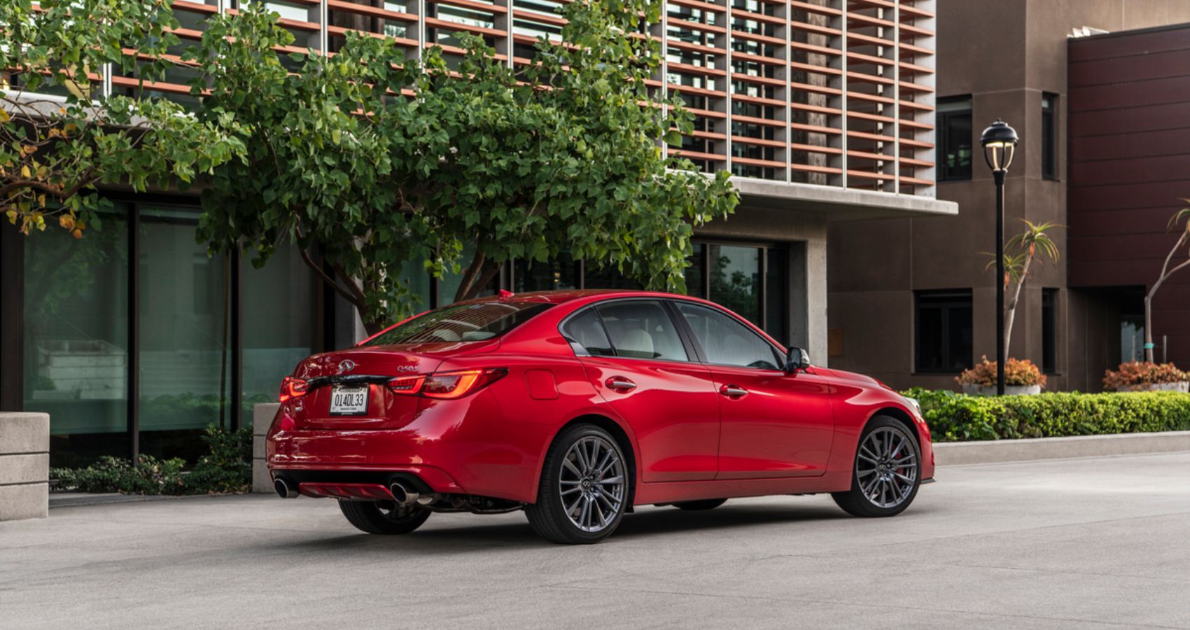 red 2023 Infiniti Q50 on the road