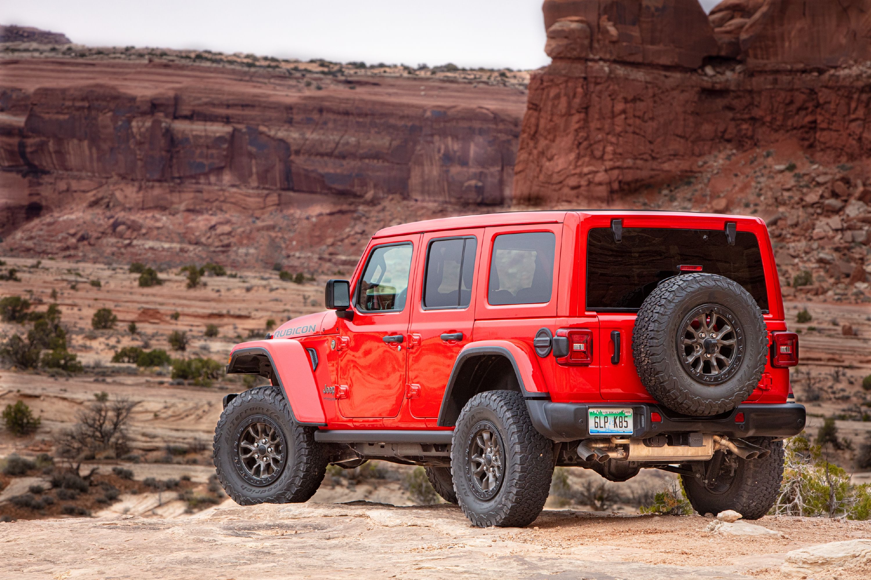 Red 2023 Jeep Wrangler Rubicon Parked On A Hill