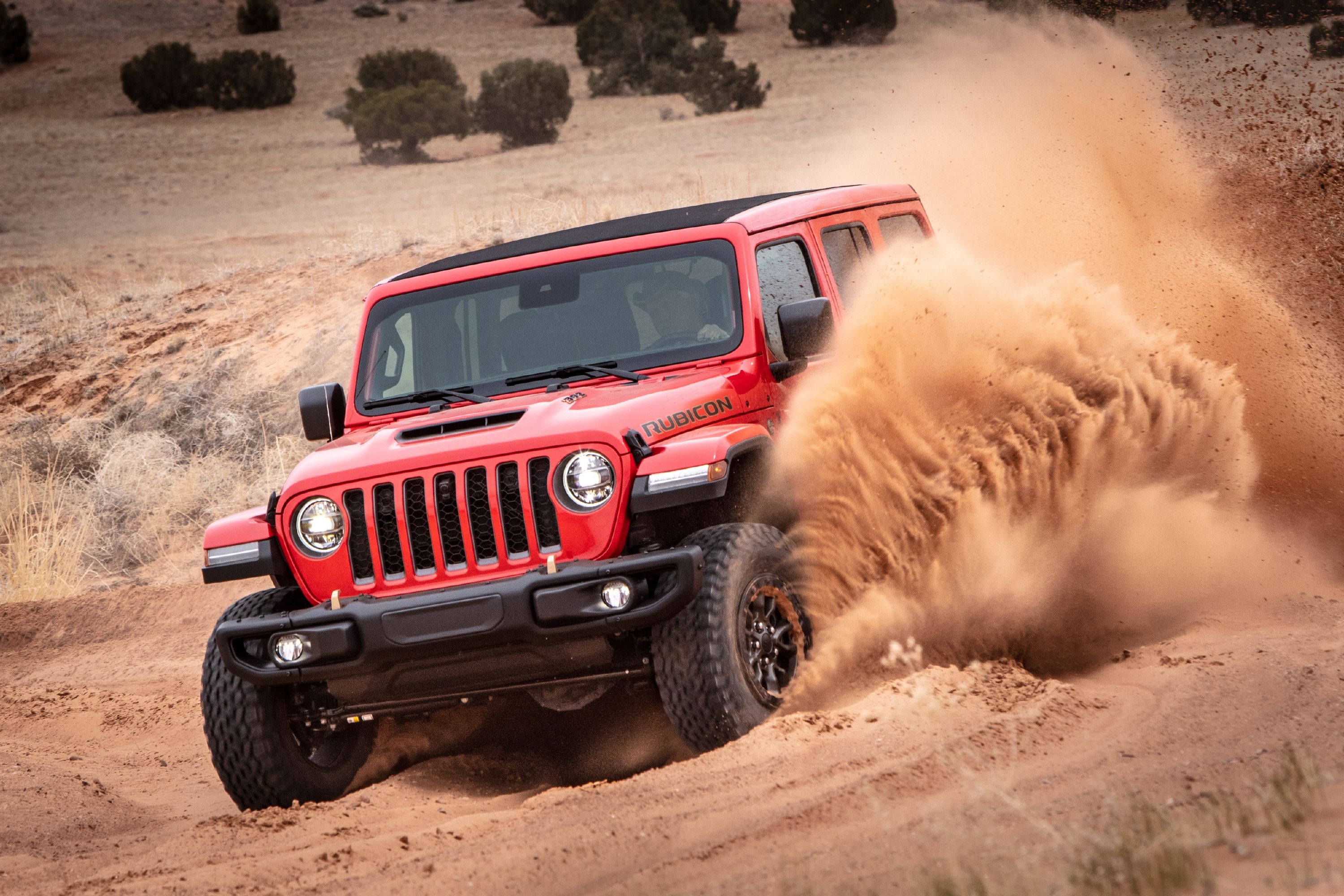 Red 2023 Jeep Wrangler Rubicon in the desert. 