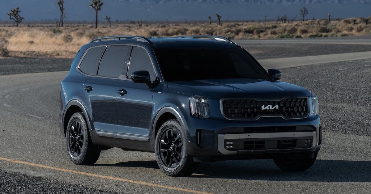A blue 2023 Kia Telluride Full body close up parked 