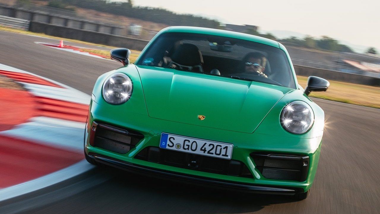 Green Porsche 911 Carrera GTS on track