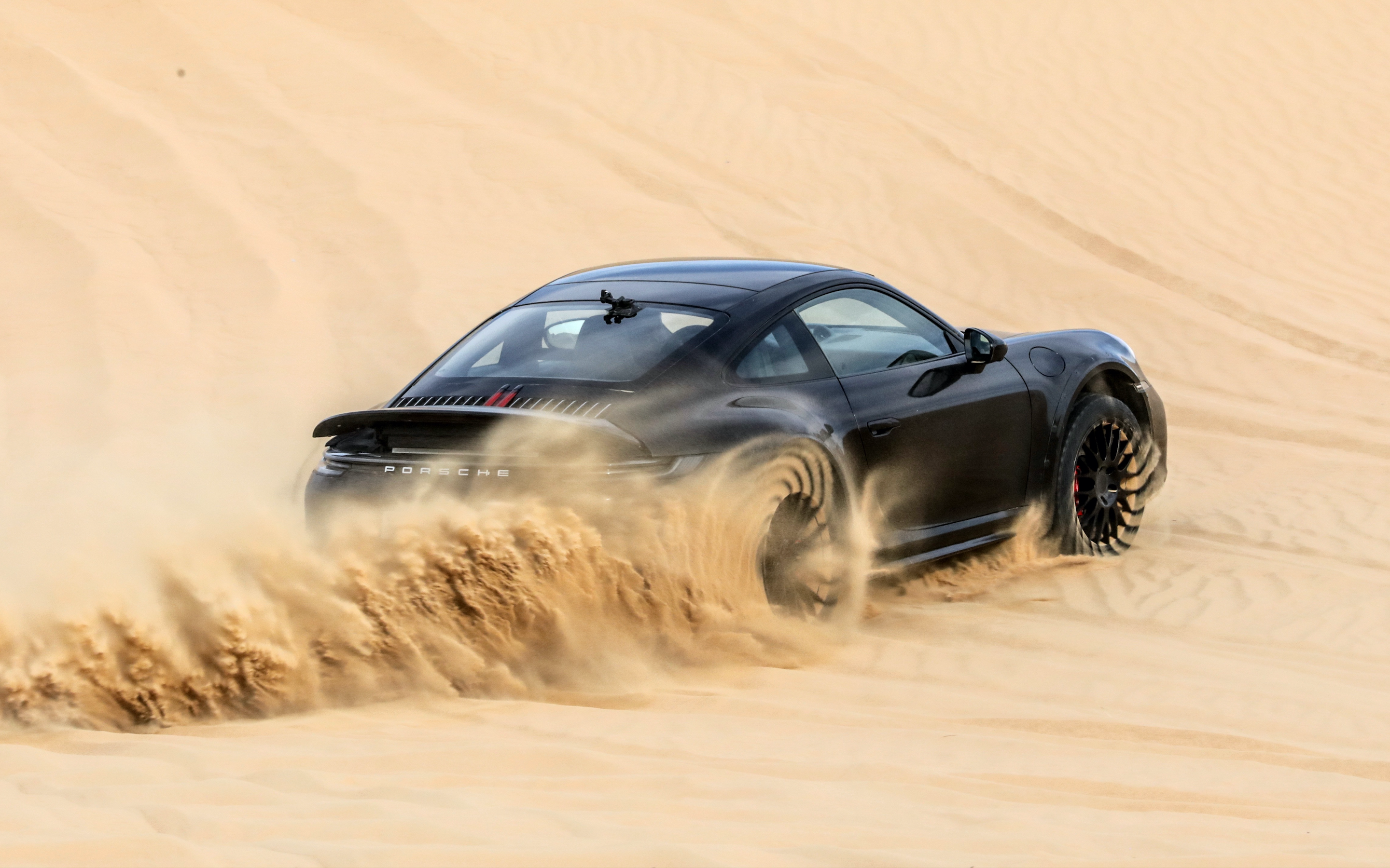 Black 2023 Porsche 911 Dakar Driving In Dunes