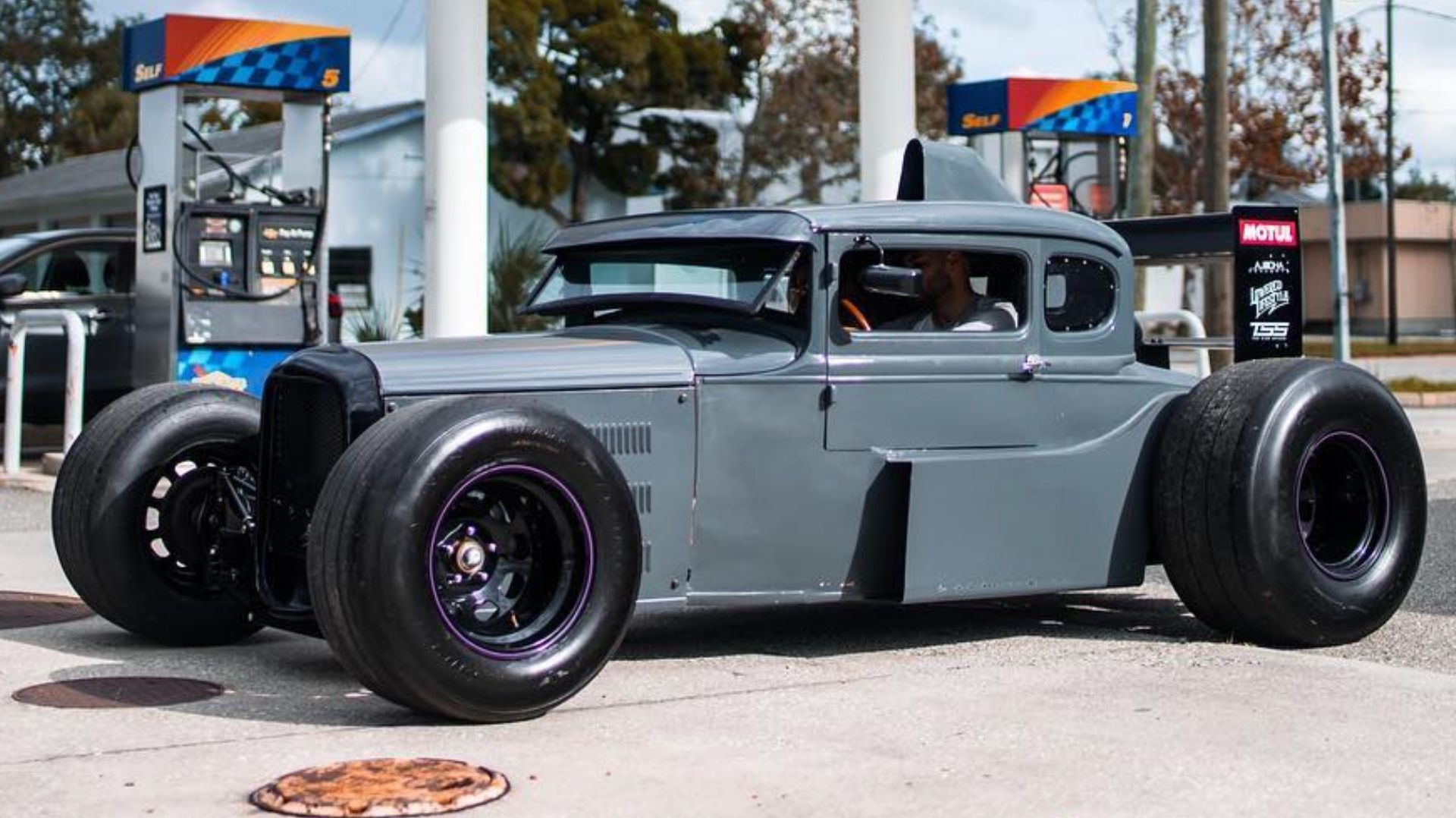 Gray 1930 Ford Model A F1 Hot Rod At A Gas Station