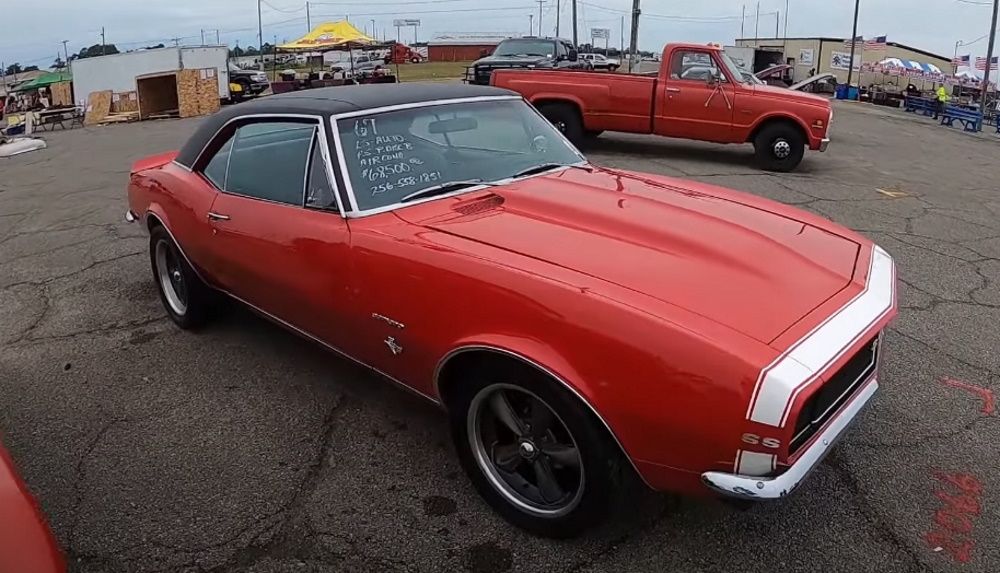 A red 1967 Chevrolet Camaro SS/RS for sale at a classic car event in Georgia