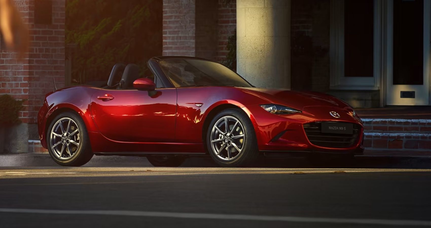 Red 2023 Mazda MX-5 Miata in the driveway