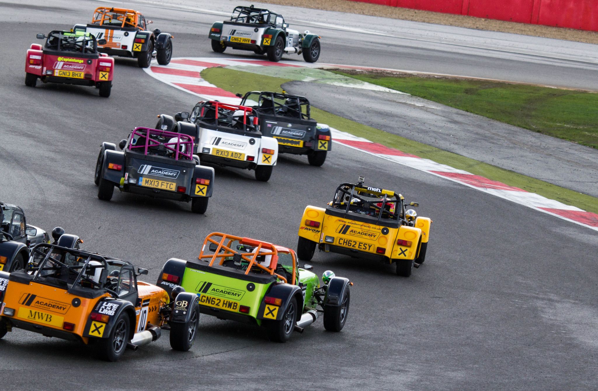 Caterham's racing on a track