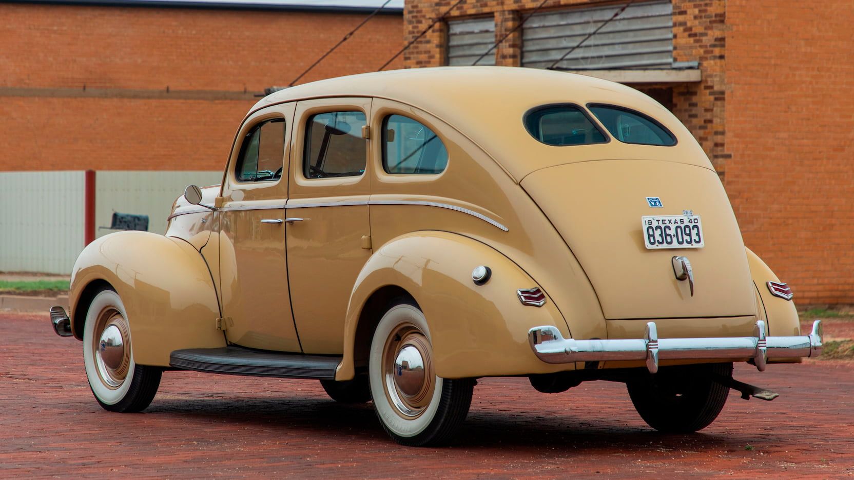 Brown 1940 Ford Standard Fordor Sedan parked