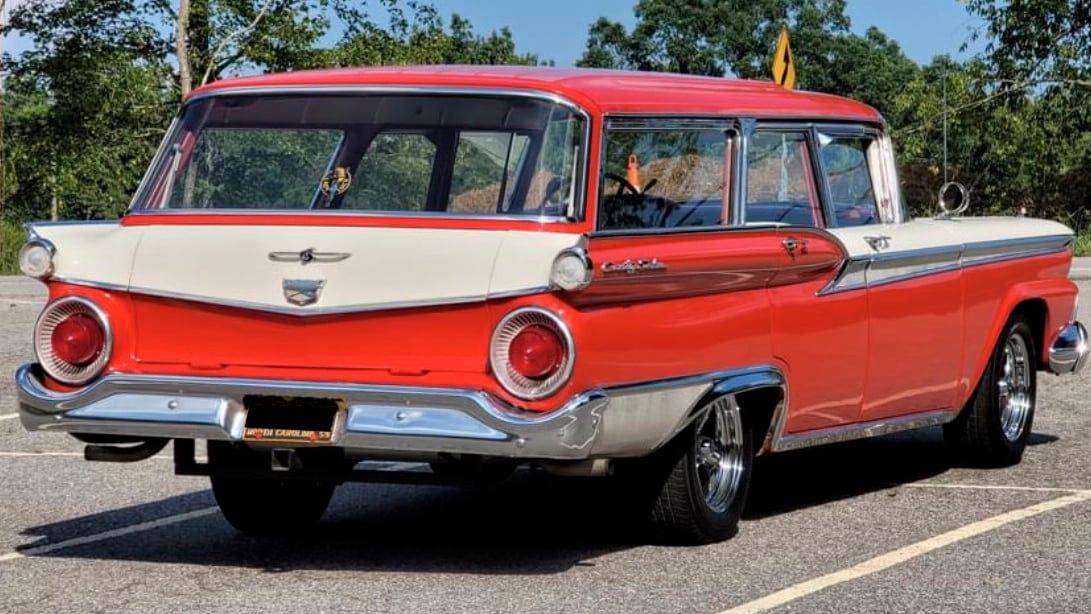 Red 1959 Ford Country Sedan Wagon on the parking lot