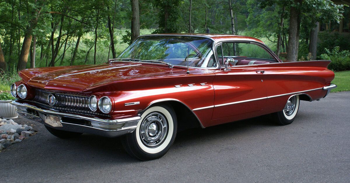 Red 1960 Buick Invicta on the road