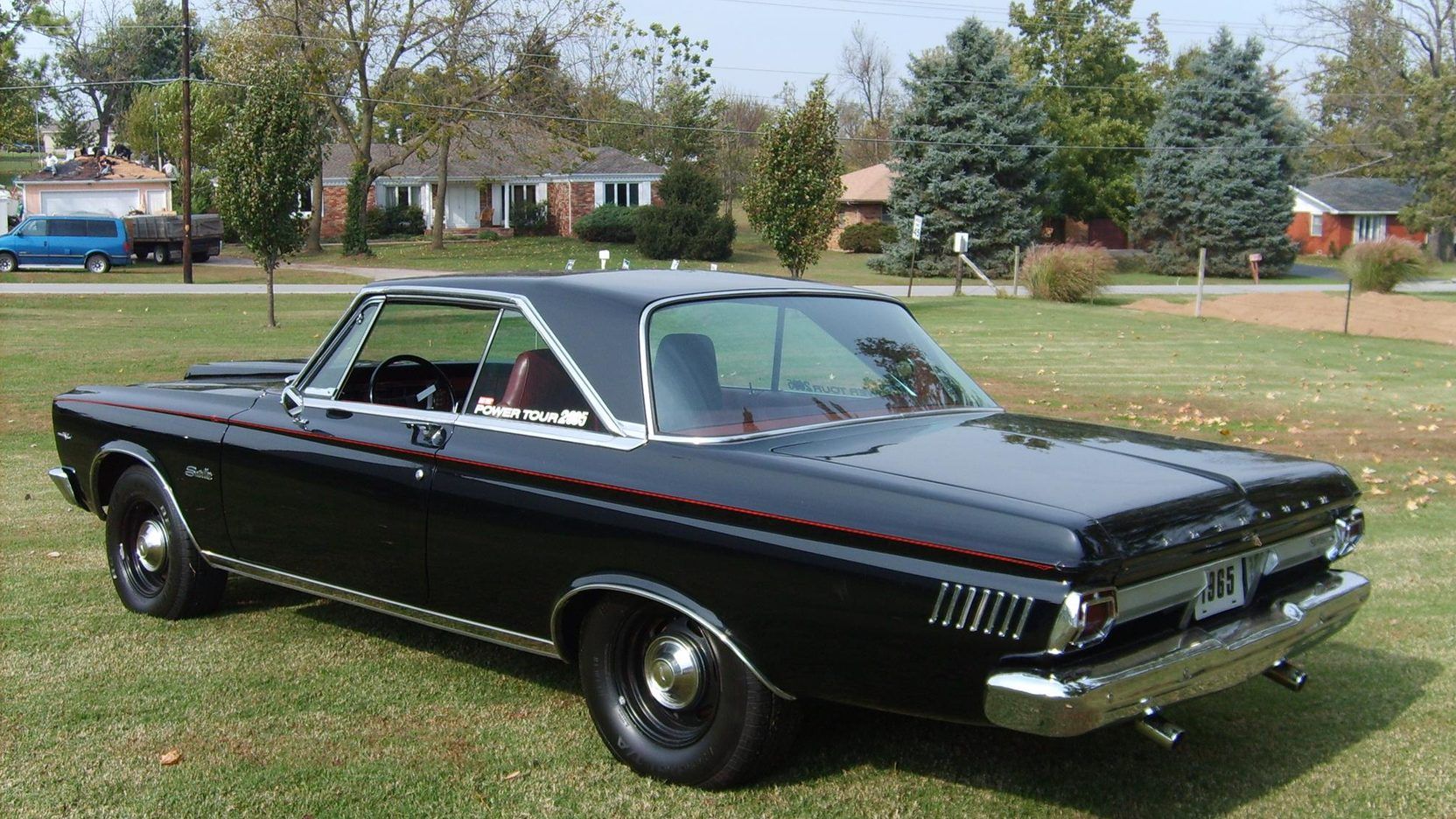 Black 1965 Plymouth Satellite Parking