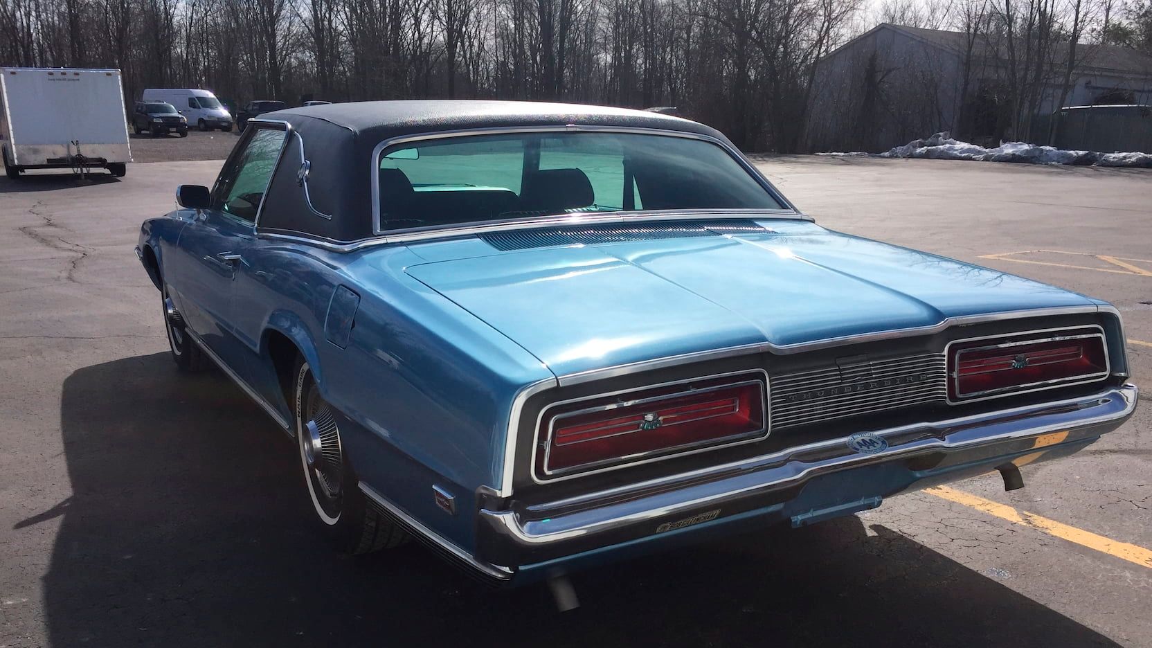 Blue 1969 Ford Thunderbird parked