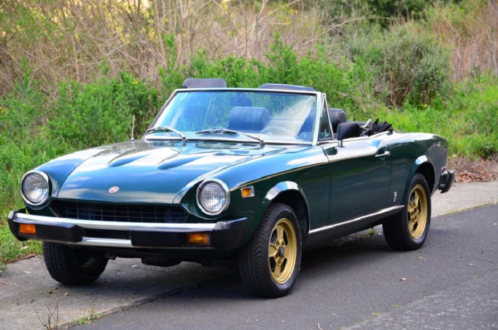Front shot of a green 1975 Fiat 124 Sport Spider