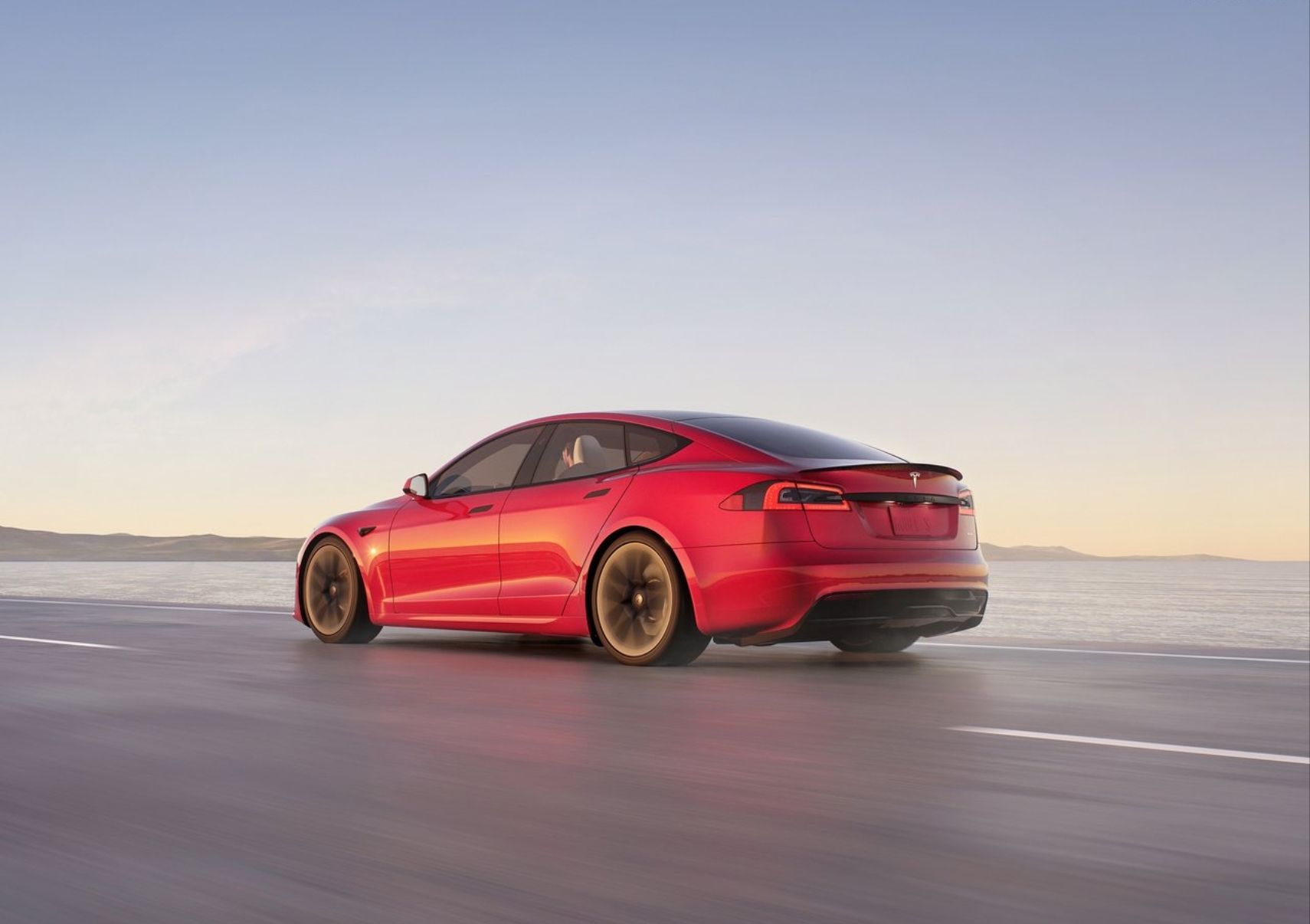 Red 2021 Tesla Model S driving