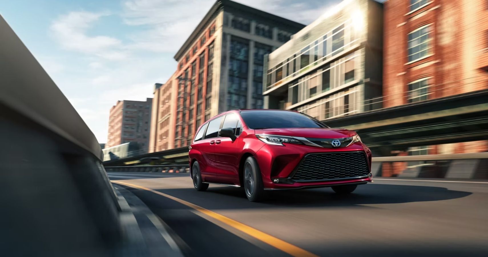 2023-toyota-sienna-exterior-front-angle-driving-on-road