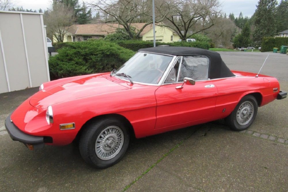 Side shot of a red 1978 Alfa Romeo Spider