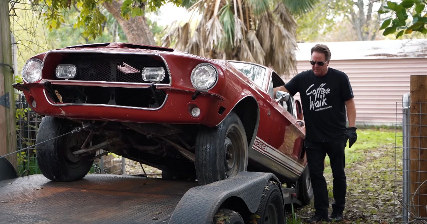 Dennis Collins loads a 1968 Ford Shelby Mustang GT500KR onto a trailer