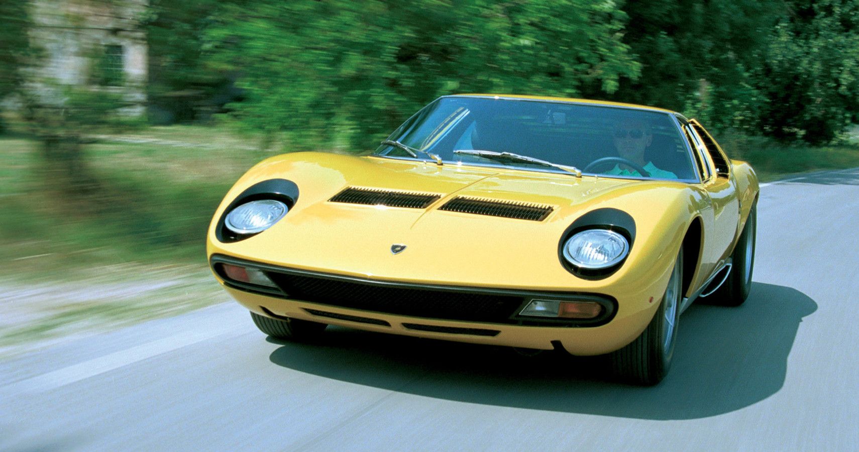 Yellow Lamborghini Miura on the road