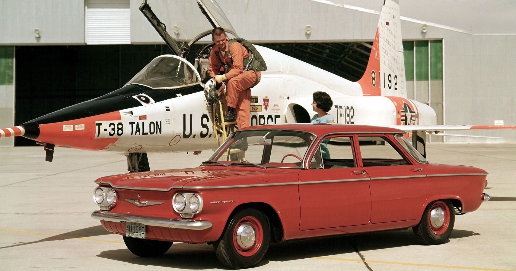 A parked orange 1960 Corvair