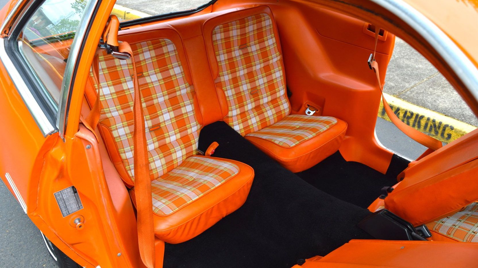 Backseat upholstered in orange plaid