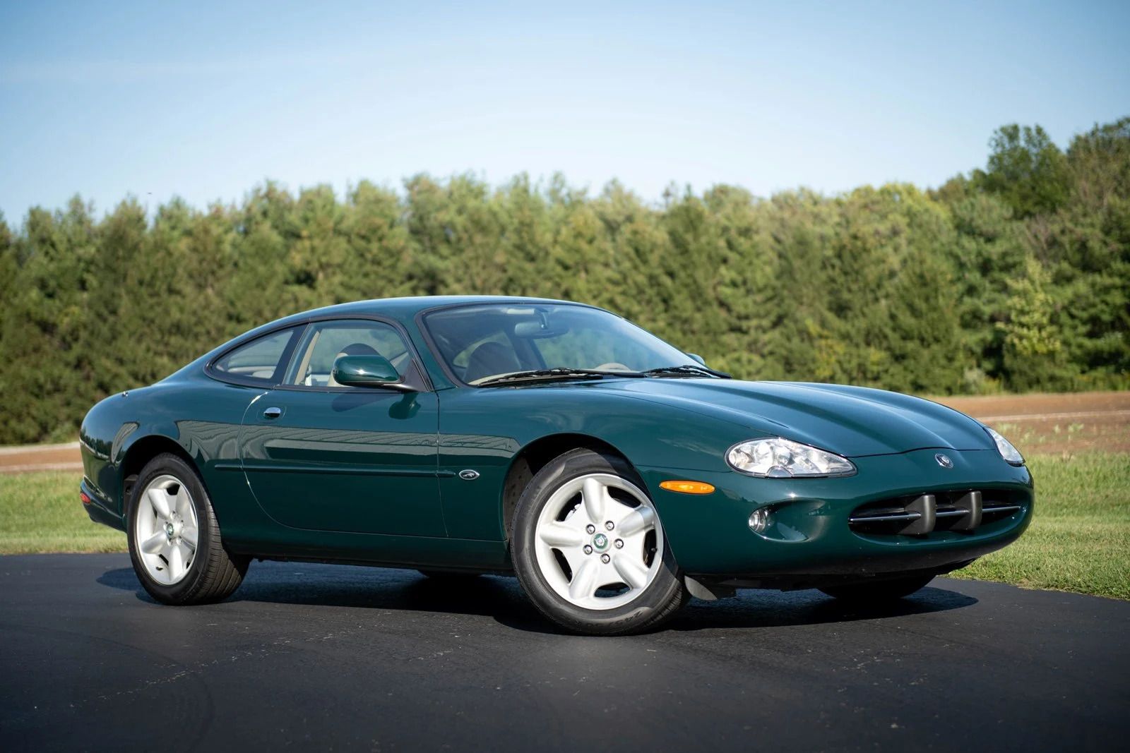 Green 1997 XK8 Coupe parked