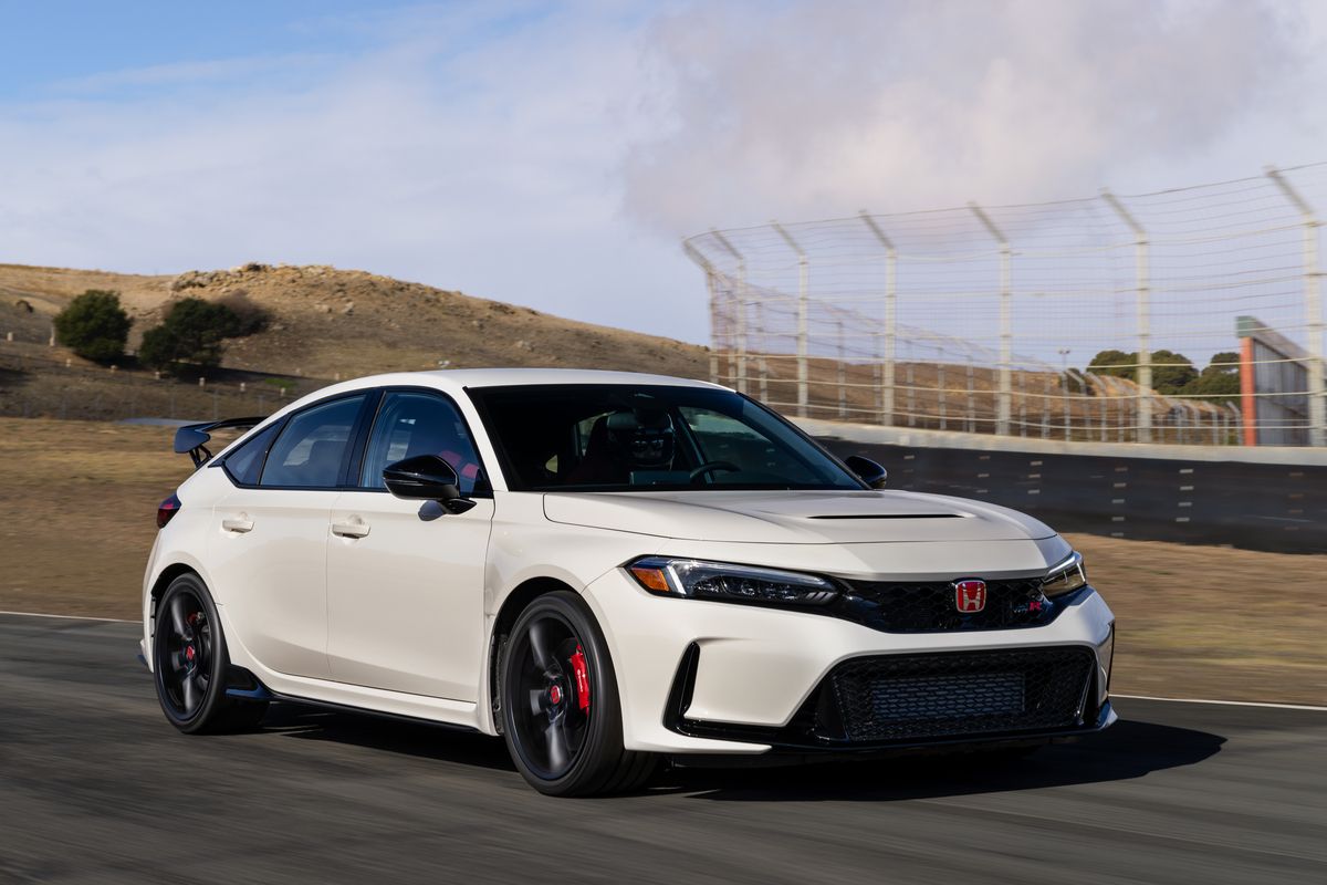 White Honda FL3 Civic Type R on a racetrack