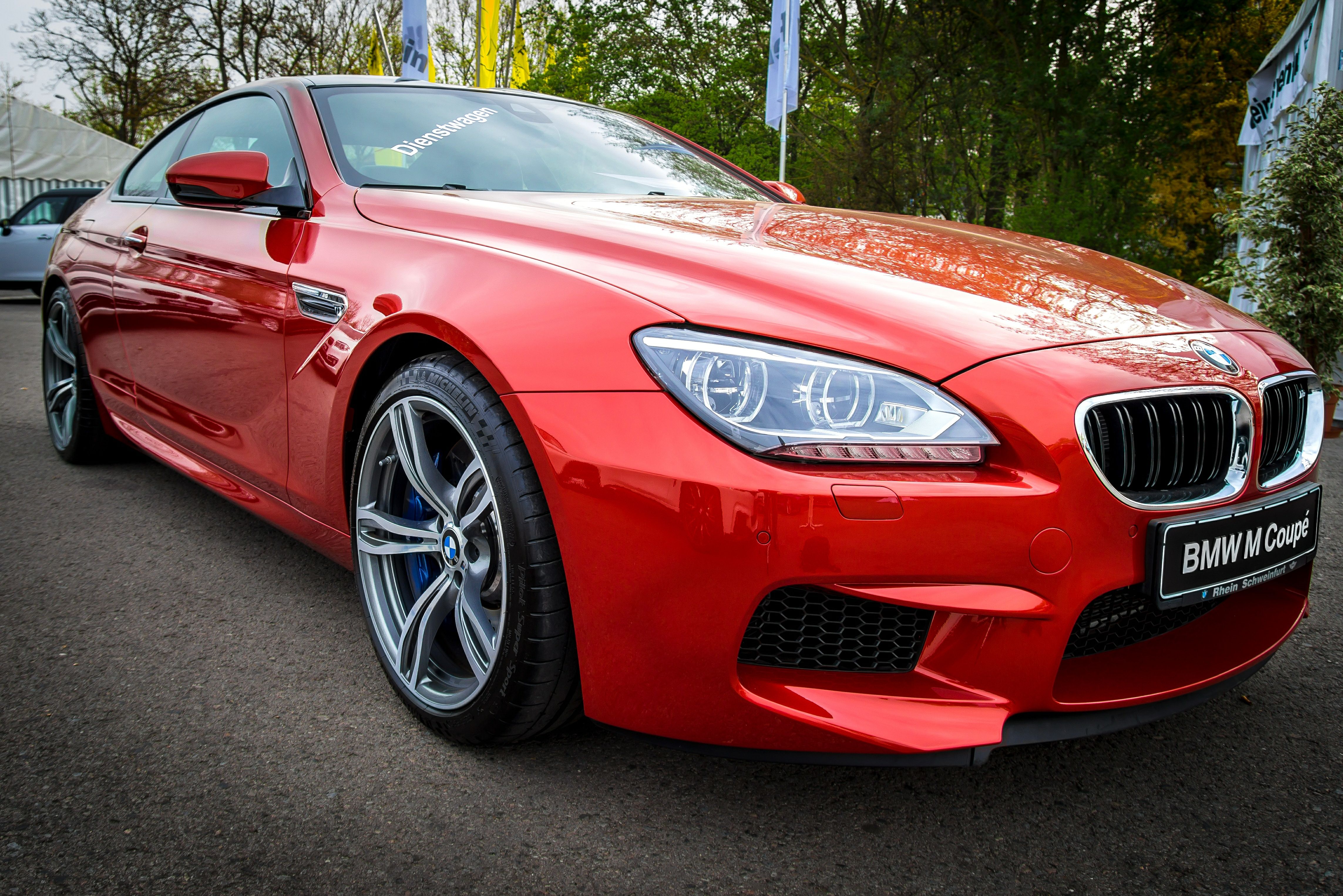 Red BMW M6 Coupe on road