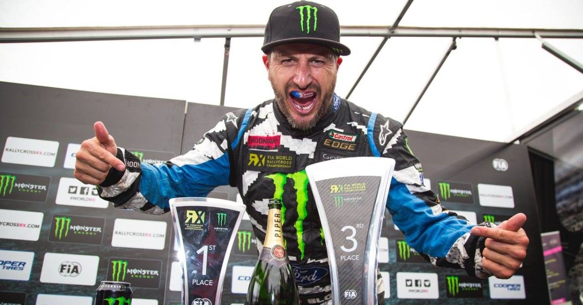 Ken Block with his winnings at a rally event