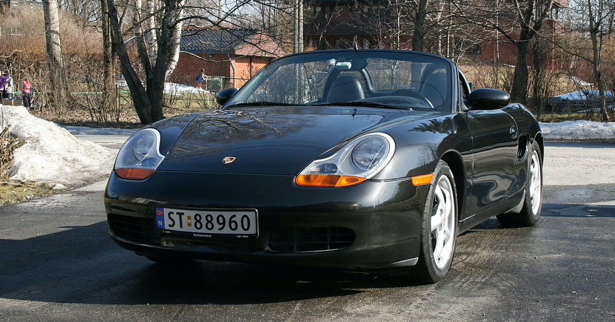 A black 1998 Porsche Boxster parked
