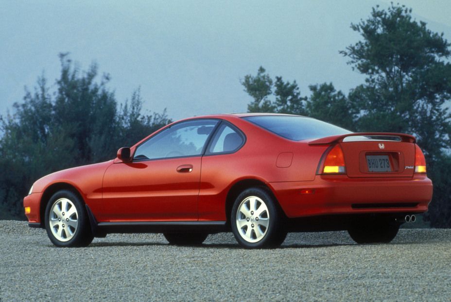Red 1992 Honda Prelude on the road