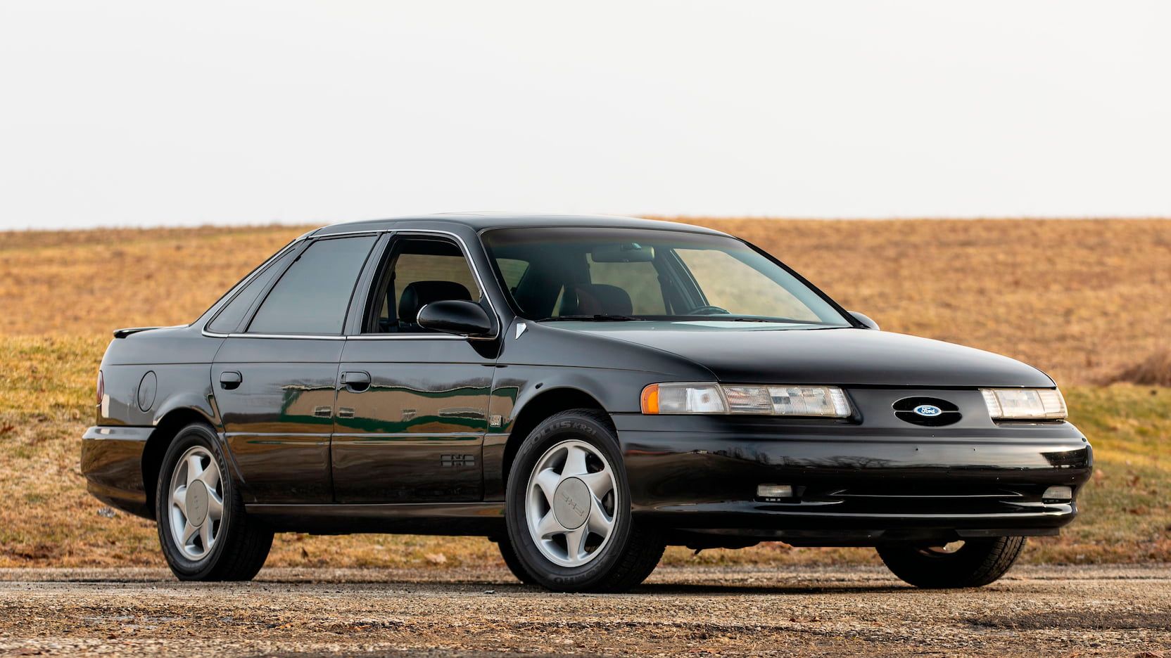 Black 1993 Ford Taurus SHO Parked Outside