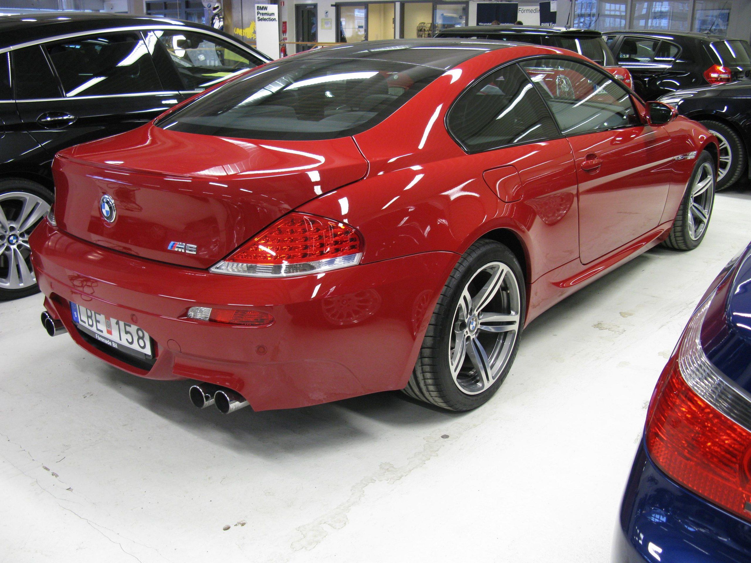 Red BMW M6 Coupe in showroom