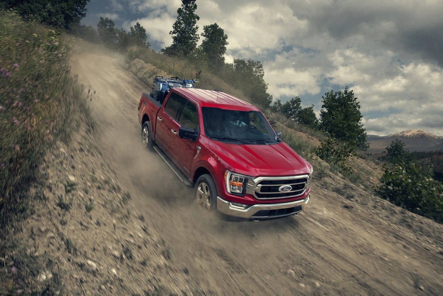 The 2023 Ford F-150 rushes down the hill. 