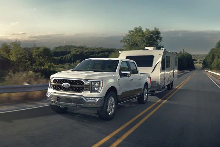 The 2023 Ford F-150 tows a trailer. 