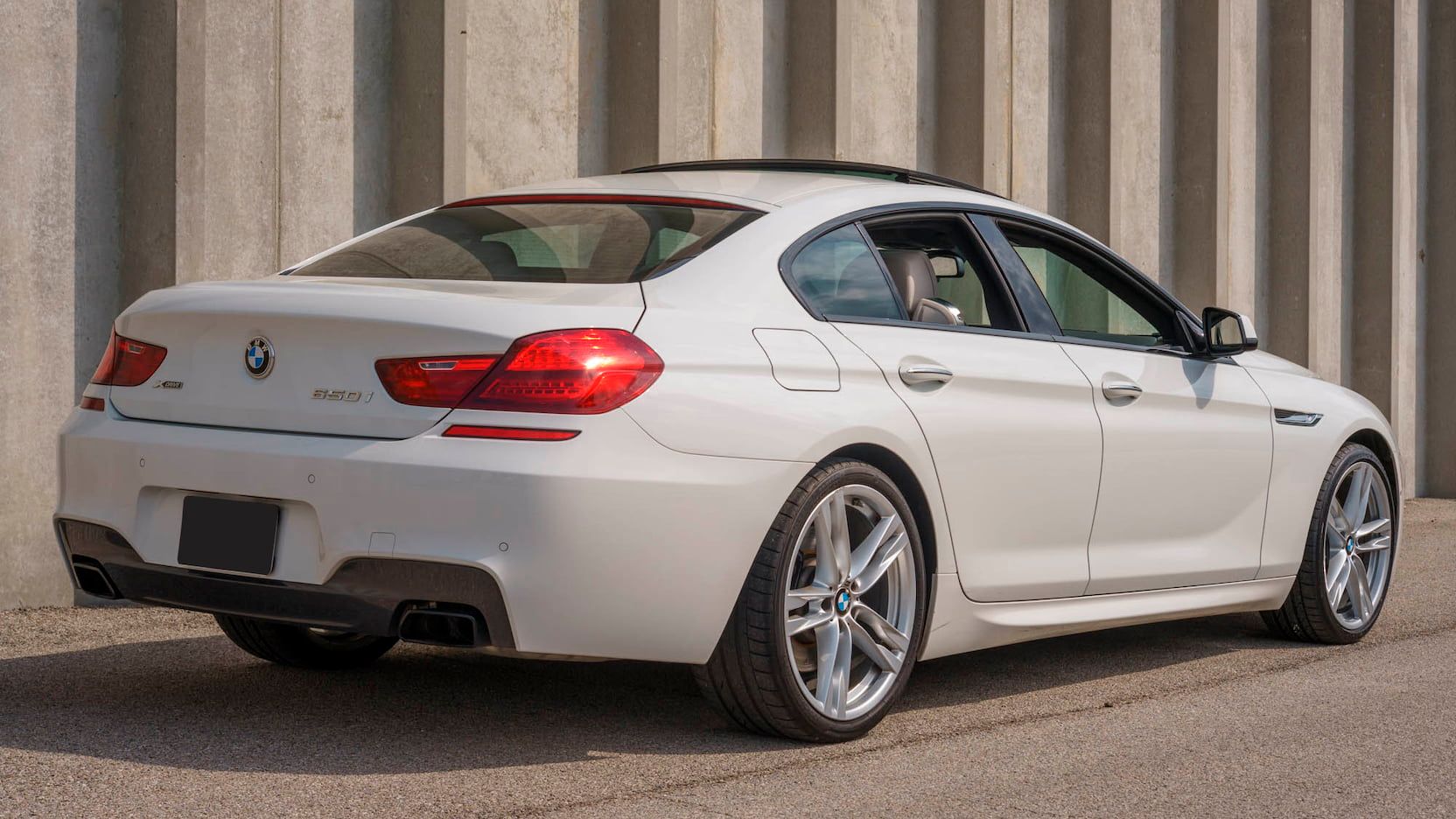 Angled Rear View Of White BMW 650I Xdrive Gran Coupe - 3rd generation 2015-2019