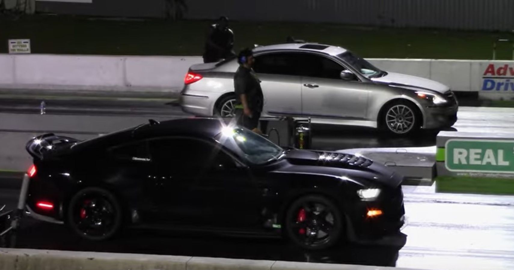 Black Shelby Ford Mustang GT500 and Champagne Genesis Sedan Drag Race 