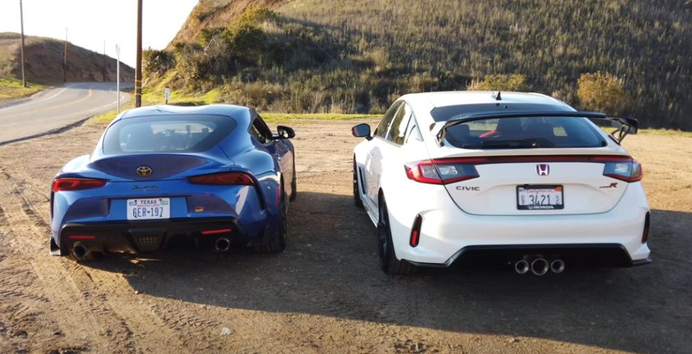 A blue 2023 Toyota GR Supra parked next to a white 2023 Honda Civic Type R