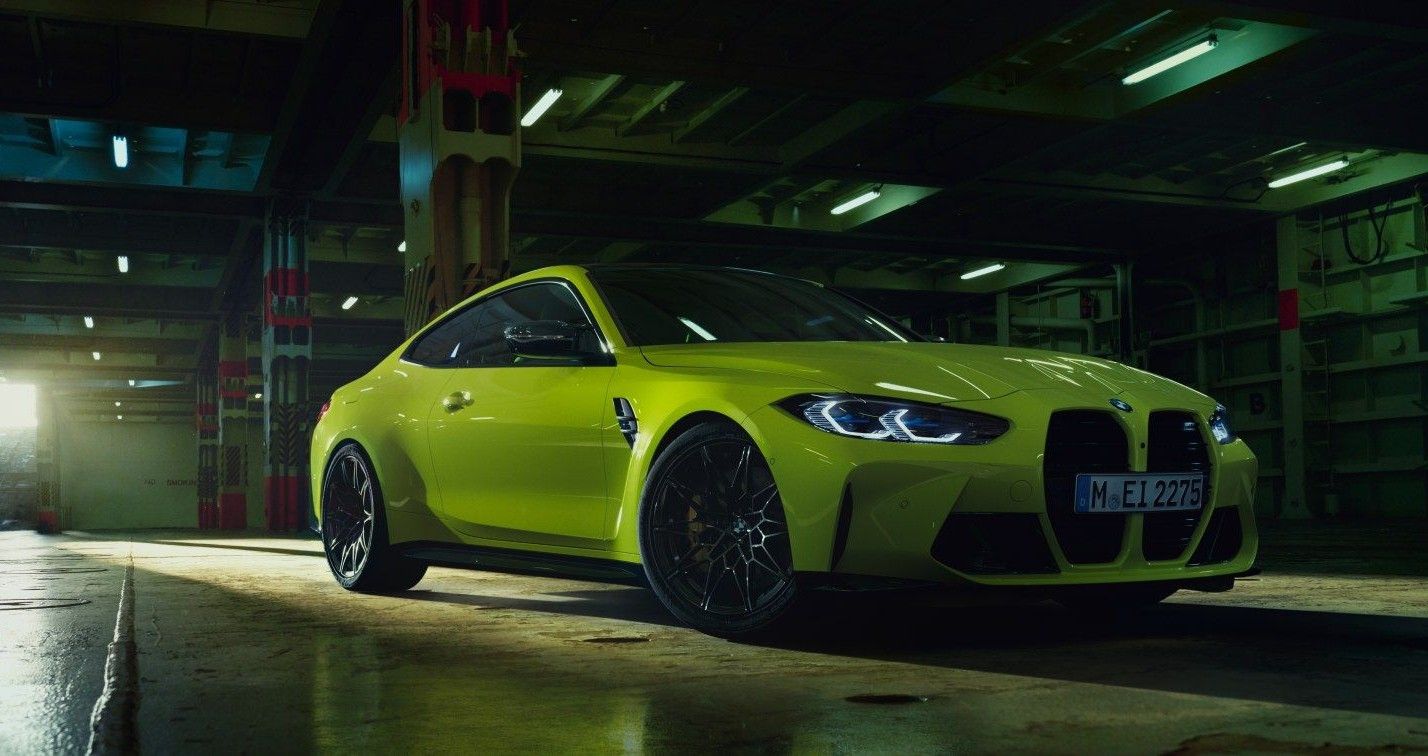 yellow BMW M4 Coupe in garage, three quarter view